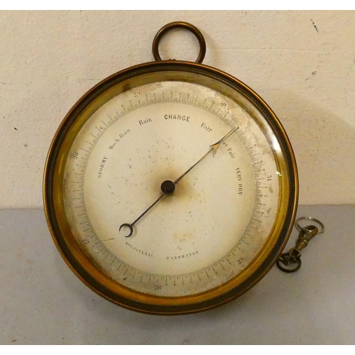 90 - A brass cased circular holosteric barometer. 
12.5 cm diameter.