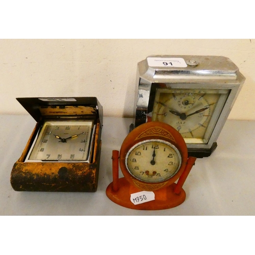 91 - A French chrome cased mantle clock, together with an 8 day travel clock and a pocket watch sized man... 