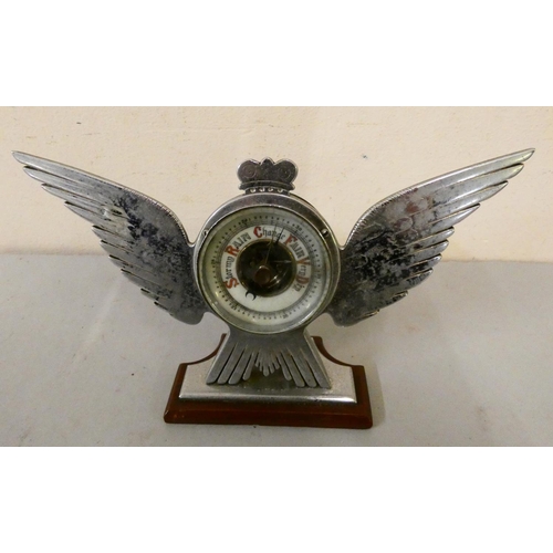 92 - A chromed desktop barometer in the form of a bird with outstretched wings.
10cm tall 20cm wide.