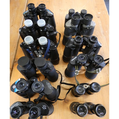 69 - Thirteen pairs of binoculars, cased/uncased to include Tasco, Prinz, Miranda, and Zenith.