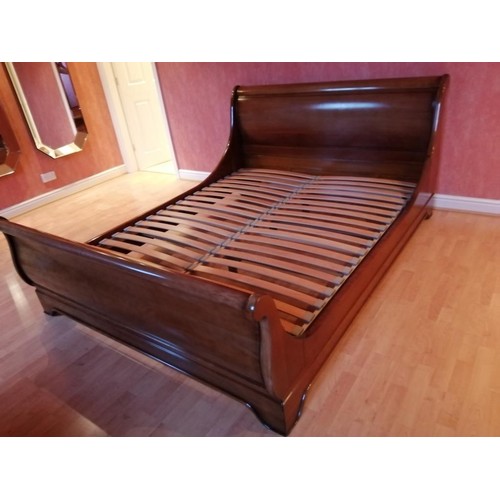 427 - A Antoinette French style cherry wood sleigh bed, king size.