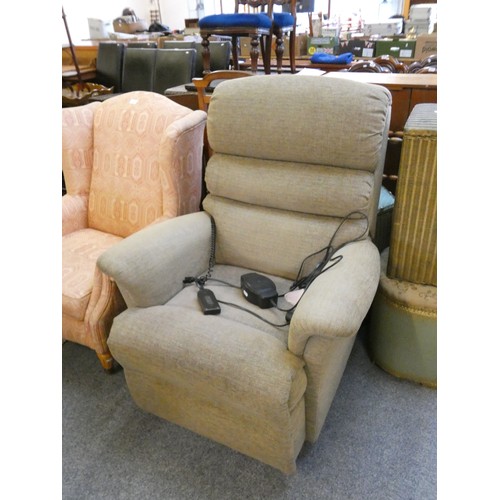 444 - An electric reclining armchair in beige fabric.