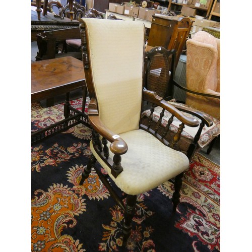 446 - A rush seated ladderback rocking chair and a Victorian upholstered mahogany armchair (2).