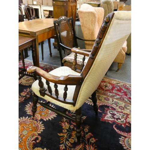 446 - A rush seated ladderback rocking chair and a Victorian upholstered mahogany armchair (2).