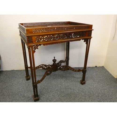 451 - A mahogany silver table, with pierced gallery, raised on column legs, 62 x 42 cm.