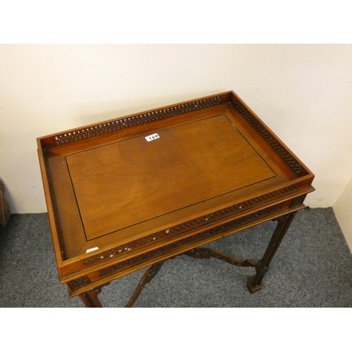 451 - A mahogany silver table, with pierced gallery, raised on column legs, 62 x 42 cm.