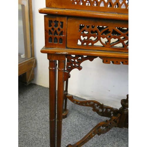 451 - A mahogany silver table, with pierced gallery, raised on column legs, 62 x 42 cm.