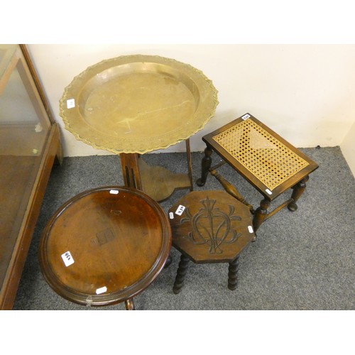 452 - A brass table top raised on an oak frame, two stools and a wine table (4).