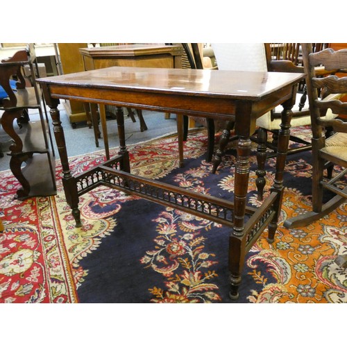 453 - An Edwardian mahogany side table, raised on turned supports, with pierced stretchers, 90 x 44 cm and... 