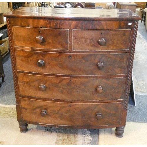 466 - A Victorian bow front chest of two short over three long drawers with spiral turned corners, raised ... 