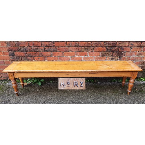 469 - A Highland Railway (HR) pitch pine waiting room bench, raised on turned legs, branded multiple times... 