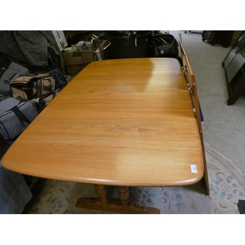 422 - An Ercol medium oak refectory extending dining table, 106 x 102 cm, with three extra lengths, extend... 