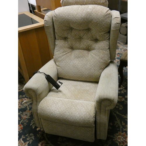 429 - An electric reclining armchair in beige fabric.