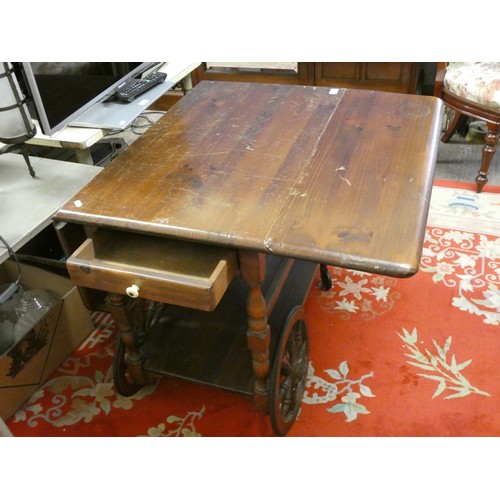 430 - A pine drop leaf tea trolley/table with under tier.