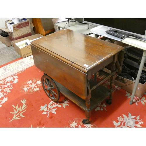 430 - A pine drop leaf tea trolley/table with under tier.