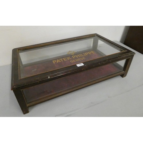 455 - A mahogany rectangular bijouterie cabinet, the hinged top painted Patek Philippe, 74 x 42 cm.