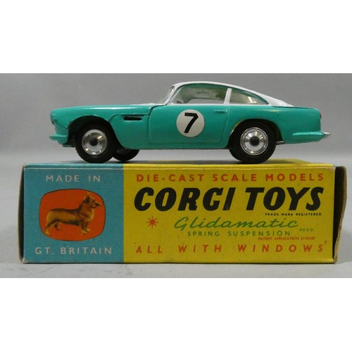 90 - Corgi Toys 309 Aston Martin D.B.4 Competition Model, white/turquoise body, lemon interior, spun shap...
