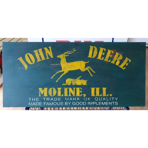 122 - A painted advertising sign for John Deere, 40 x 90 cm.