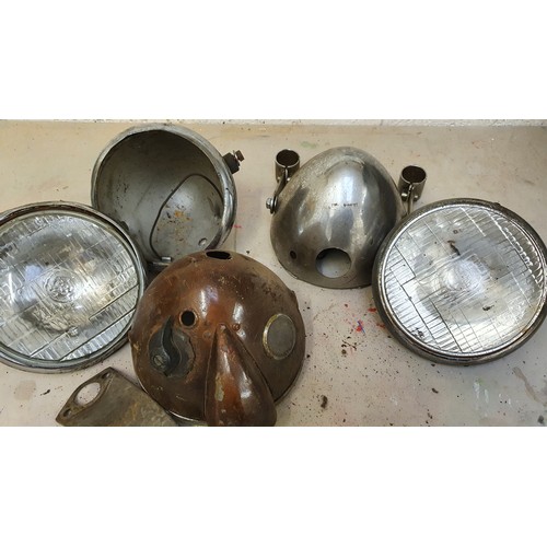 183 - Three unknown headlights and two oil tanks