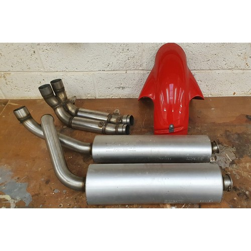 180 - A pair of used Ducati 916 exhausts, down pipe and hugger, together with other motorcycle spares.