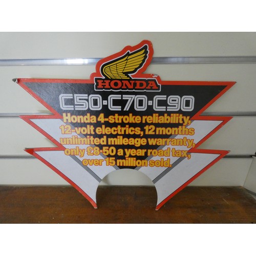 128 - A Honda C90/C70/C50 cardboard advertising sign, 32 x 39 cm.