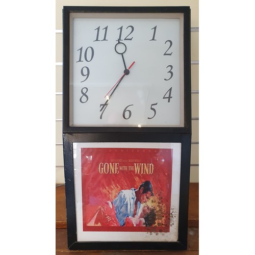 63 - A metal cased wall mounted clock/advertising cabinet, later quartz movement, 67 x 35 cm.