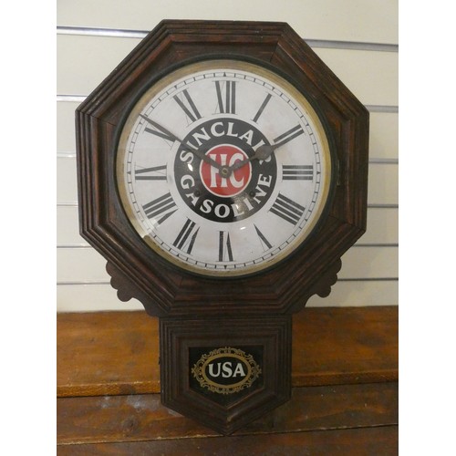 83 - An American drop dial wall clock, the dial painted with Sinclair Gasoline, 63 cm.