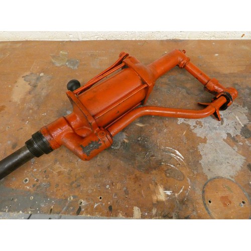 74 - A painted barrel hand crank pump, overall length 101 cm.