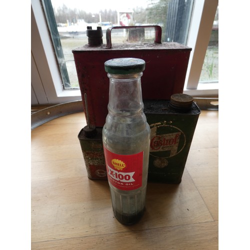 72 - A Shell X100 glass motor oil bottle and 3 cans