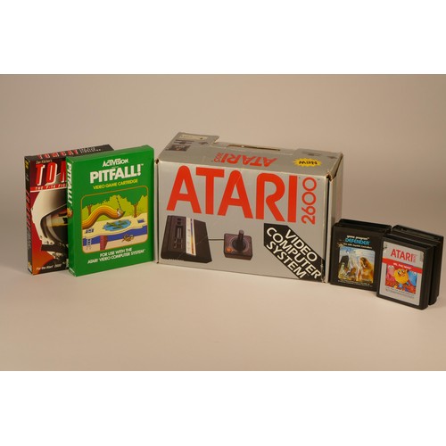 14 - Boxed Atari 2600 complete with power supply, joystick controller, tv lead, owners manual. Including ... 