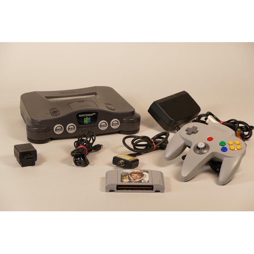 17 - Boxed Nintendo 64 games console together with a boxed controller and a vibration pack and a selectio... 