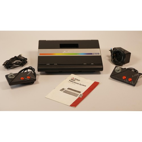 33 - Atari 7800 video game system with power supply, two ministick controllers, selection of fifteen game... 