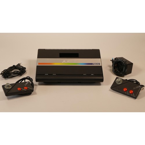 33 - Atari 7800 video game system with power supply, two ministick controllers, selection of fifteen game... 