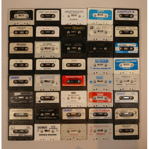 52 - A large collection of over a hundred uncased Sinclair Spectrum 48K/128K cassette games, titles to in... 