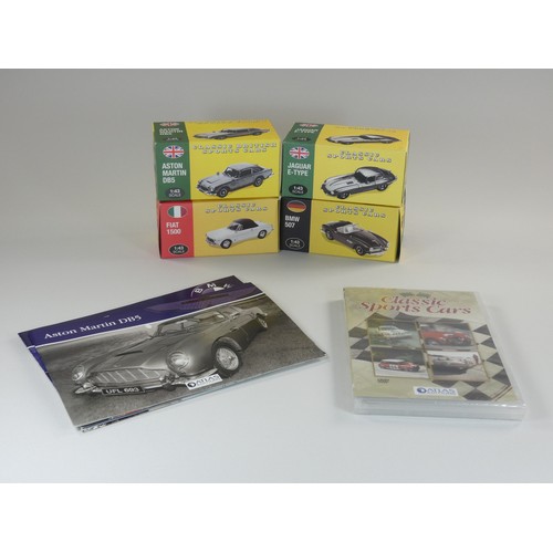 97 - A collection of four boxed Atlas cars with DVD and pamphlet. To include-