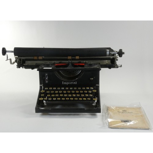 218 - An Imperial Model 50 standard typewriter complete with instruction book, together with another Imper... 