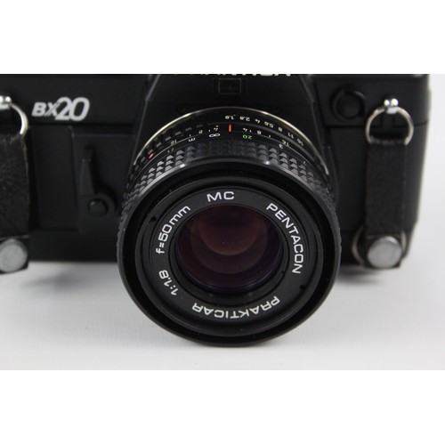 305 - Praktica BX20 SLR Film Camera w/ Pentacon Prakticar 50mm F/1.8 MC Lens  The camera is WORKING and in... 