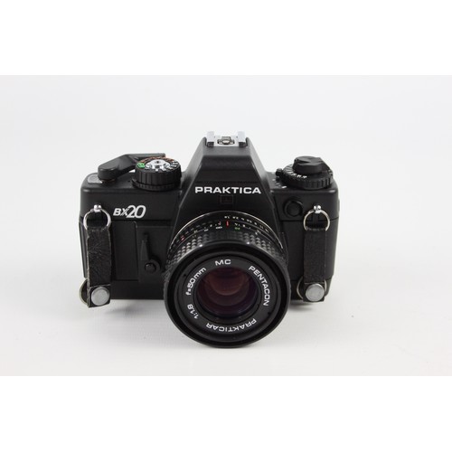 305 - Praktica BX20 SLR Film Camera w/ Pentacon Prakticar 50mm F/1.8 MC Lens  The camera is WORKING and in... 