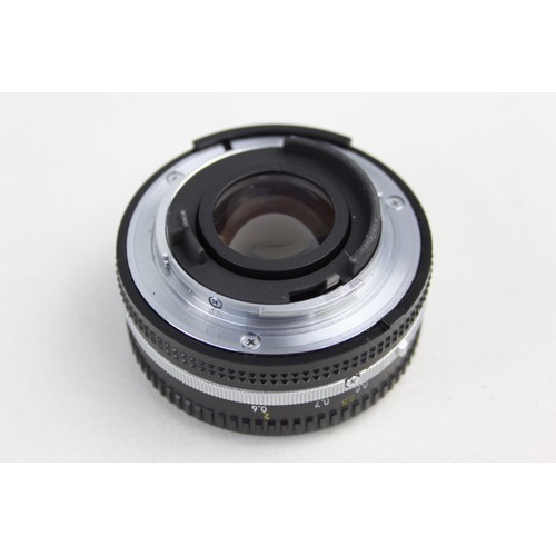 322 - Nikon Nikkor 50mm F/1.8 Pancake Lens w/ Lens Caps  Lens is mechanically working Aperture blades are ... 