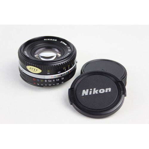 322 - Nikon Nikkor 50mm F/1.8 Pancake Lens w/ Lens Caps  Lens is mechanically working Aperture blades are ... 