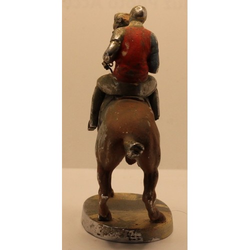 256 - A chrome and partially painted car mascot, by Louis Lejeune Ltd., in the form of a jockey on horseba... 