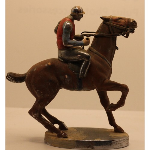 256 - A chrome and partially painted car mascot, by Louis Lejeune Ltd., in the form of a jockey on horseba... 