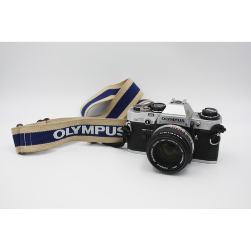 308 - Olympus OM10 SLR Film Camera Olympus OM-System 50mm F/1.8 Lens  This set is MECHANICALLY WORKING Cam... 