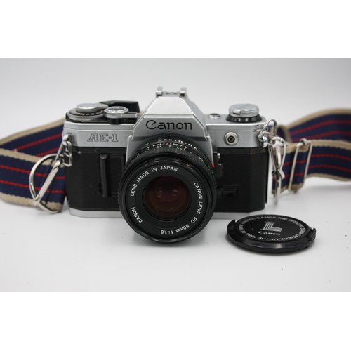 304 - Canon AE-1 SLR Film Camera Canon FD 50mm F/1.8 Lens w/ Case & Instructions  The camera is WORKING an... 