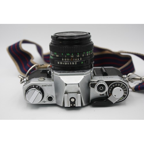 304 - Canon AE-1 SLR Film Camera Canon FD 50mm F/1.8 Lens w/ Case & Instructions  The camera is WORKING an... 