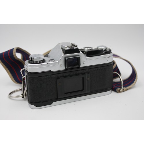 304 - Canon AE-1 SLR Film Camera Canon FD 50mm F/1.8 Lens w/ Case & Instructions  The camera is WORKING an... 