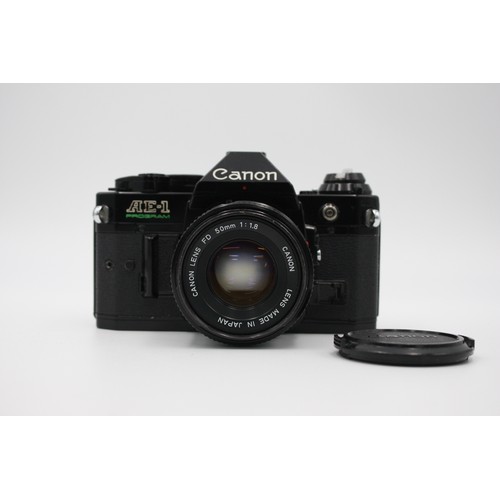 331 - Canon AE-1 Program SLR Film Camera (All Black) w/ Canon FD 50mm F/1.8 Lens  The camera is WORKING an... 