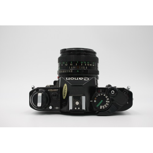 331 - Canon AE-1 Program SLR Film Camera (All Black) w/ Canon FD 50mm F/1.8 Lens  The camera is WORKING an... 