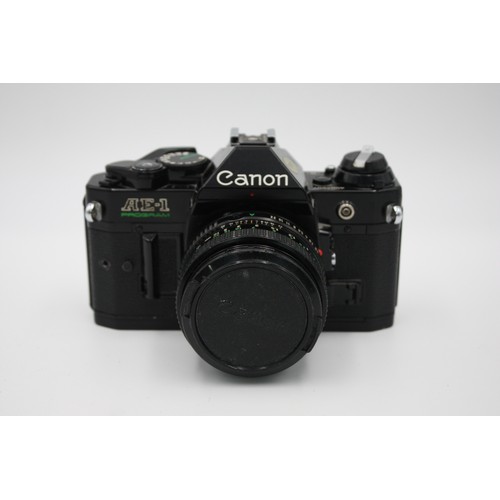 331 - Canon AE-1 Program SLR Film Camera (All Black) w/ Canon FD 50mm F/1.8 Lens  The camera is WORKING an... 