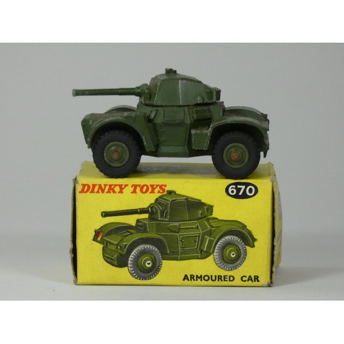 146 - Two Dinky die-cast models to include- 25 Pounder Field Gun Set 697 and an Armoured Car 670 (boxed) t... 